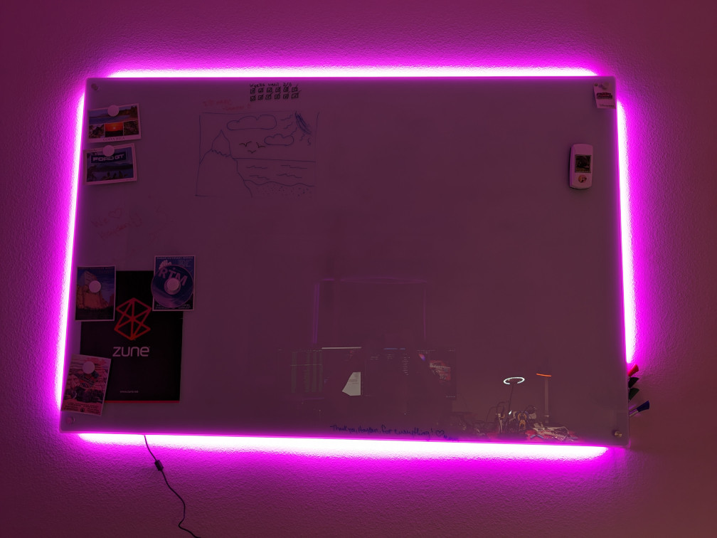 Whiteboard with LED-lit purple border